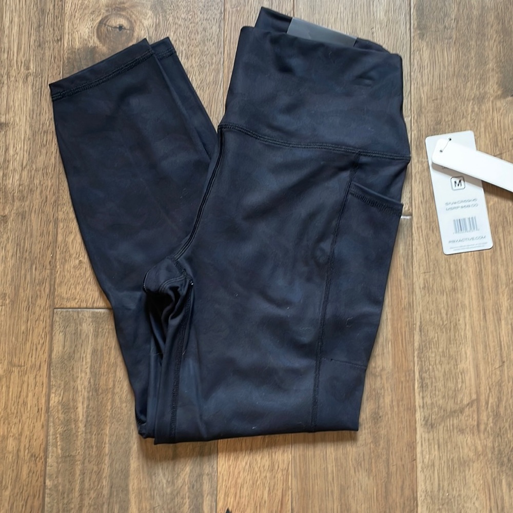 RBX Active ankle length high waisted leggings. Medium. NWT. Black with camo.
